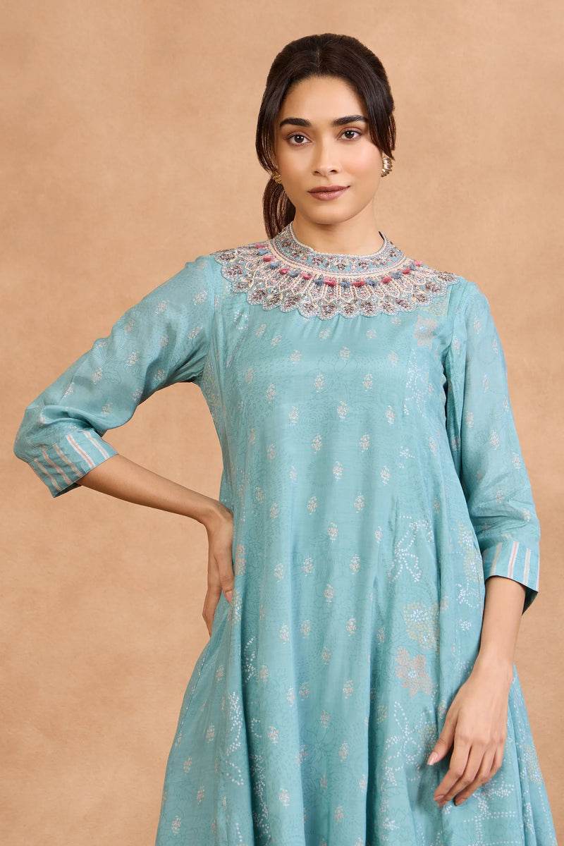 Turquoise embroidered kurta with scalloped neckline, perfect for festive or everyday wear