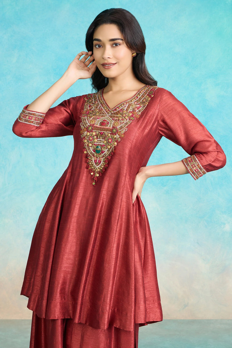 Red embroidered Indian kurta with gold detailing, perfect for festive occasions and special events.